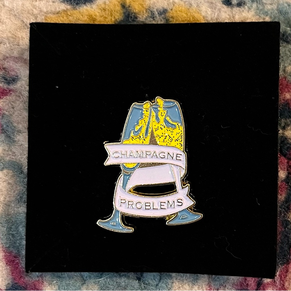 Champagne Problems enamel pin Taylor Swift